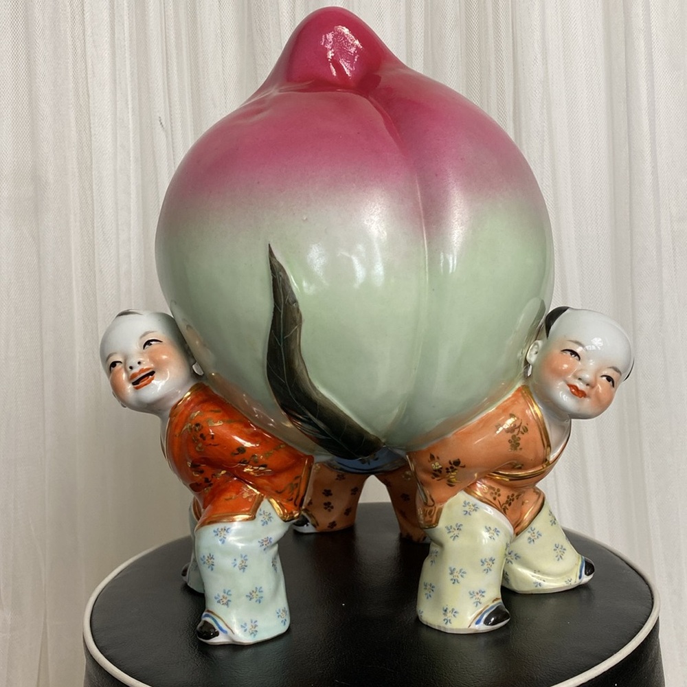 Vintage porcelain Chinese peach supported by 3 boys/men 11” tall